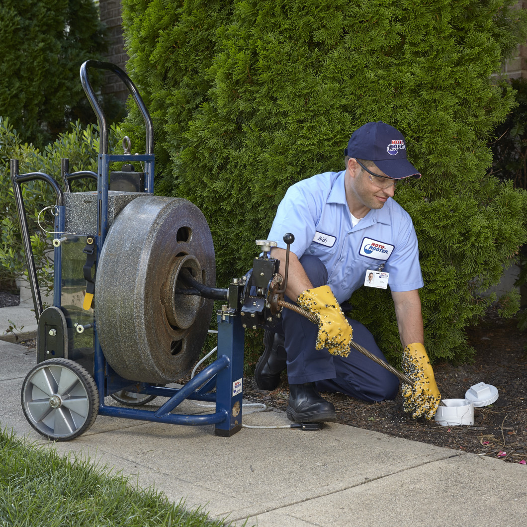 Roto-Rooter Drain Cleaning Tech at work