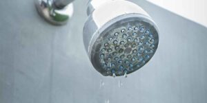 what causes low water pressure in shower